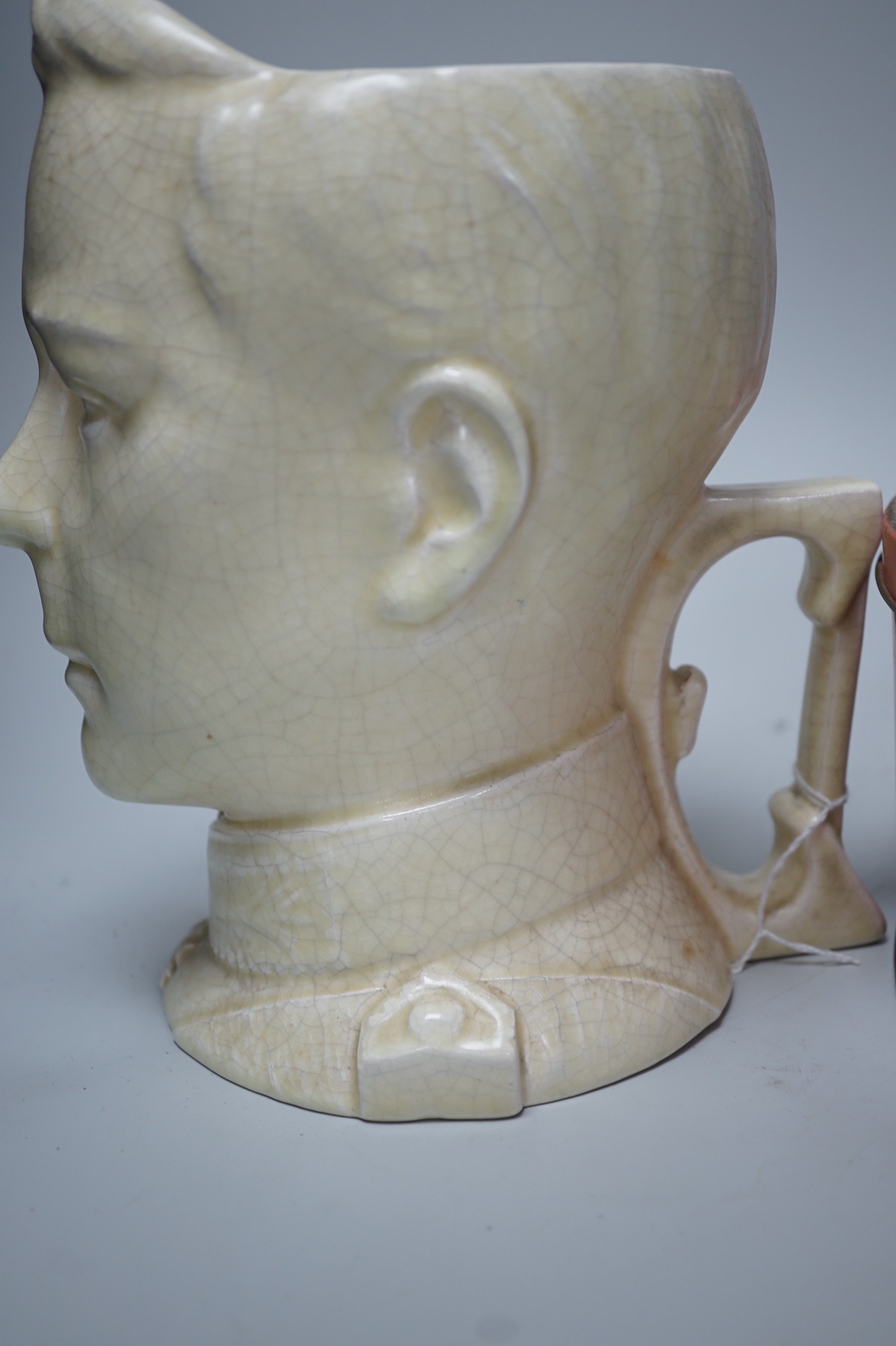 A musical Edward VII Coronation jug playing ' God save the King' and an Edward VIII biscuit tin